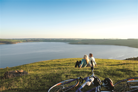 Couple relaxing looking over Lake Bullen Merri
